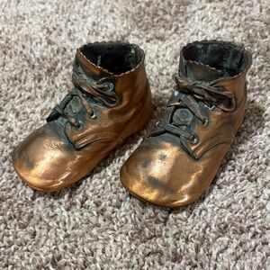 Antique bronzed copper baby shoes